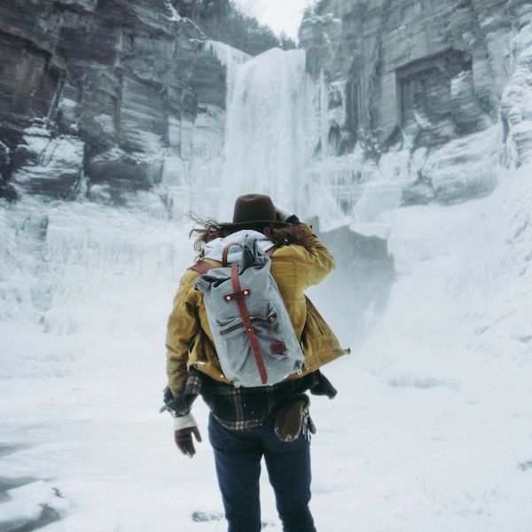 A breathtaking photograph of a frozen waterfall, captured during the serene winter season.				